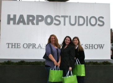 Lauren and friends in front of a sign