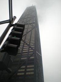 A traffic light sitting on the side of a building