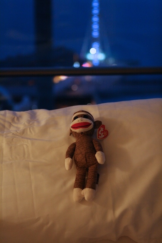 A stuffed animal sitting on a bed