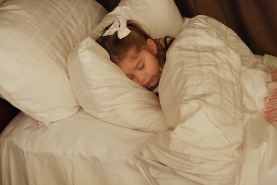 Brooke lying on a bed