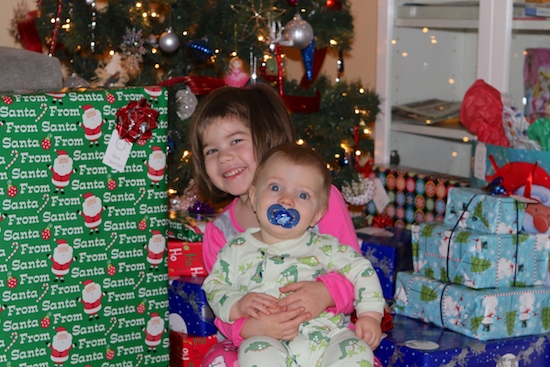 brooke and blake in front of christmas tree