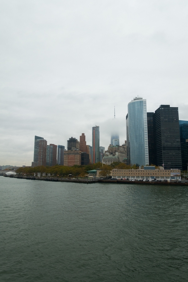 A large body of water with a city in the background