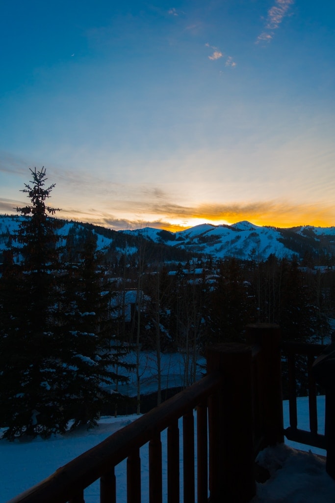 Sunset over snow covered land
