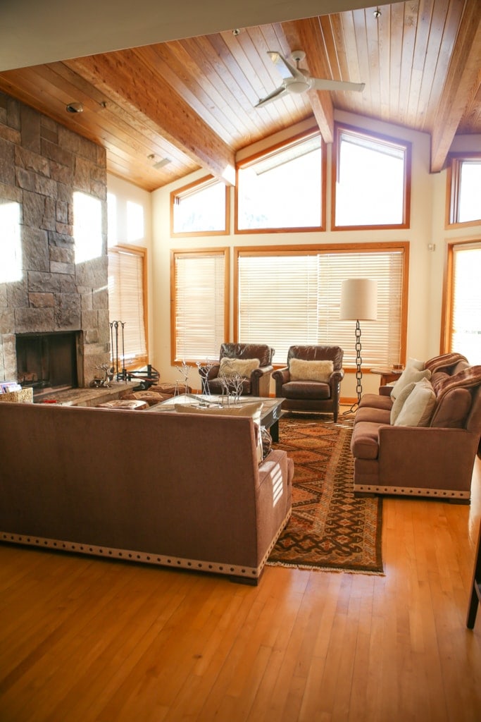 A living room filled with furniture and a large window