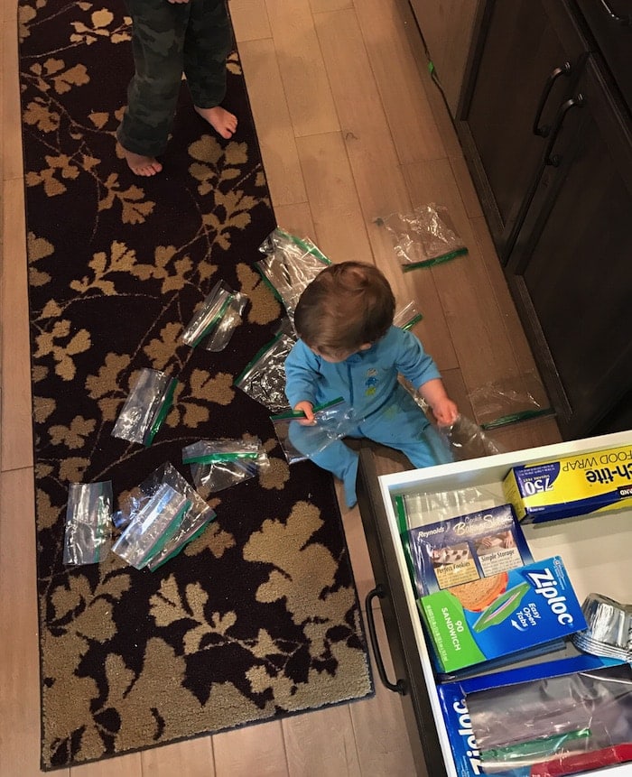 Eddie on the ground with Ziploc bags