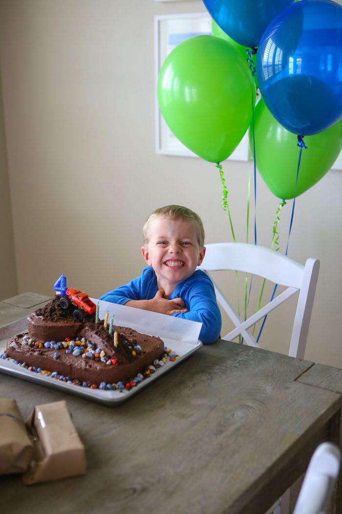 Blake sitting in front of his cake