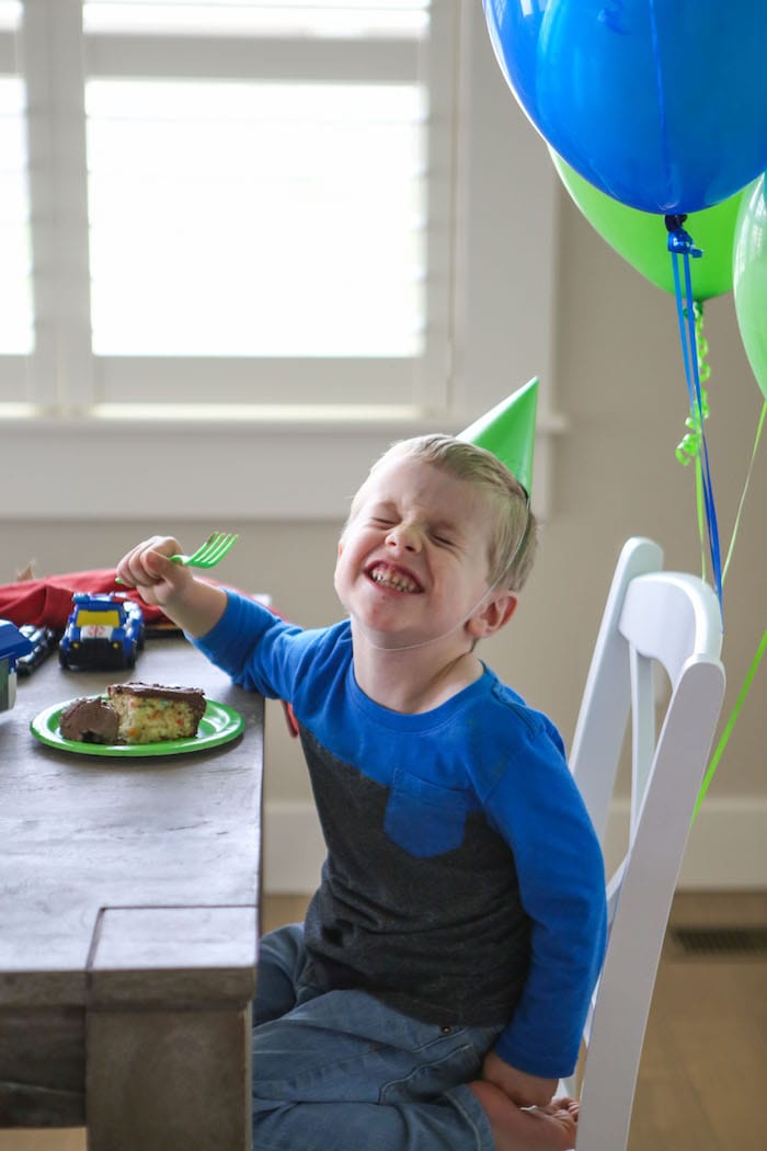 Blake sitting and eating cake