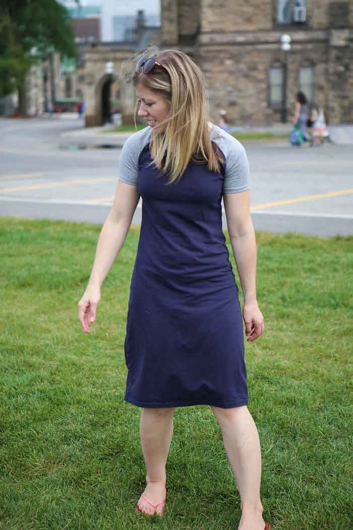 A woman that is standing in the grass