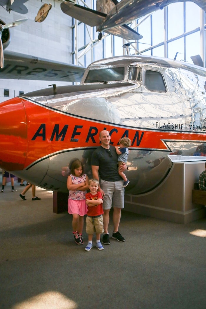 Gordon and the kids in front of a plane