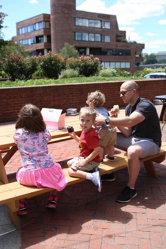 A group of people sitting on a bench