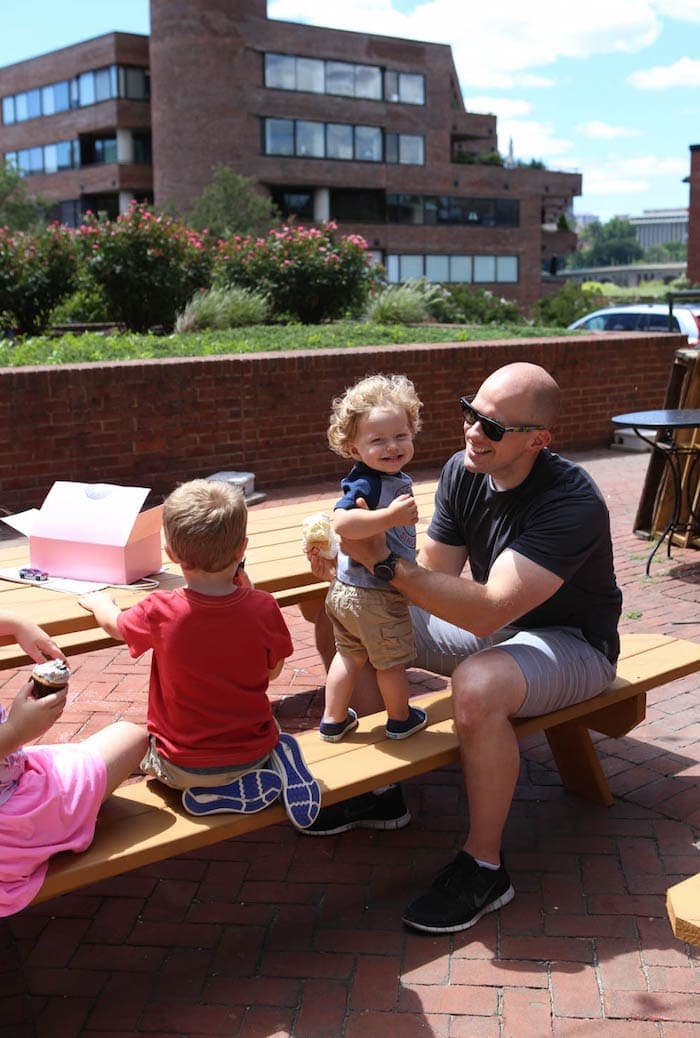 A group of people sitting on a bench