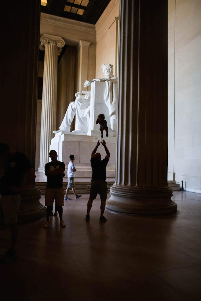 Gordon throwing Eddie up in the air at the Lincoln Memorial