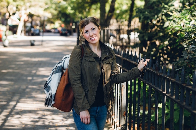 A person standing on a sidewalk