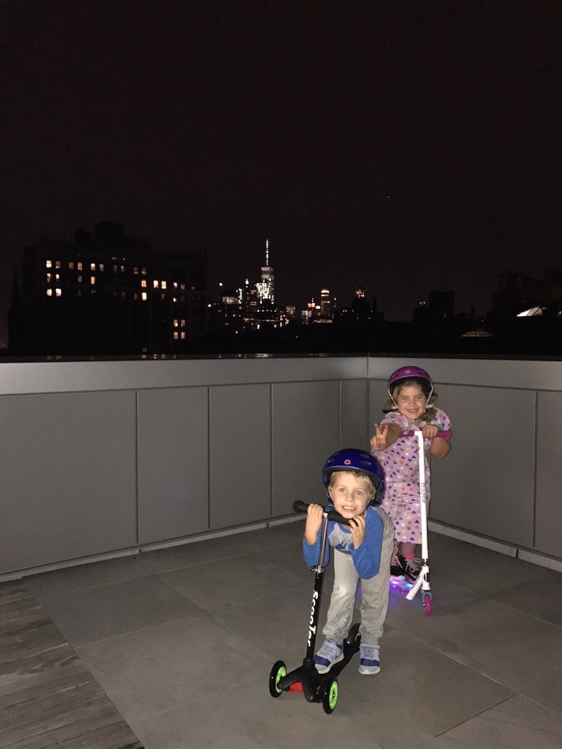 The kids on the roof of a building