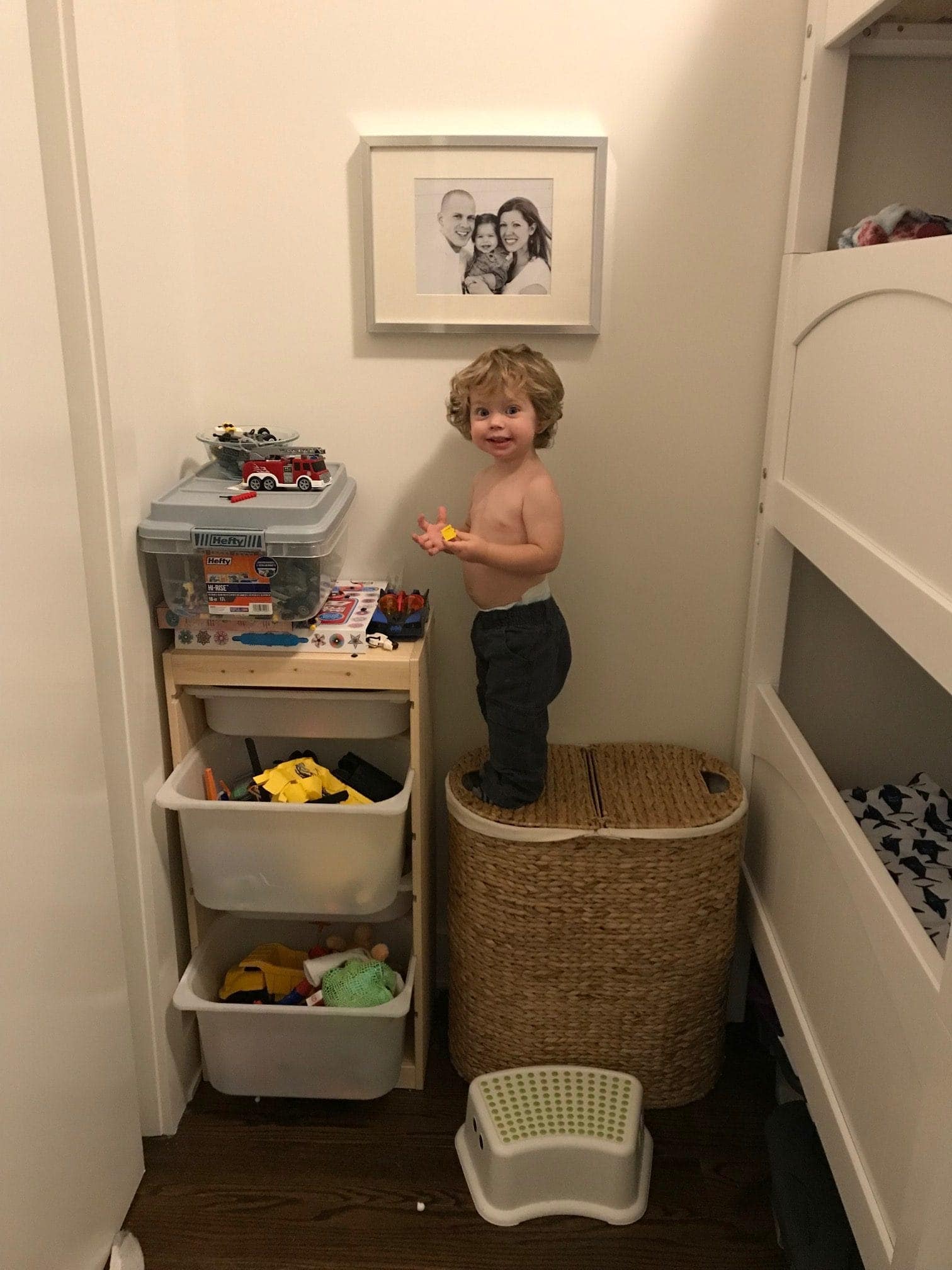Eddie standing on a hamper