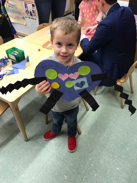 Blake holding up a craft