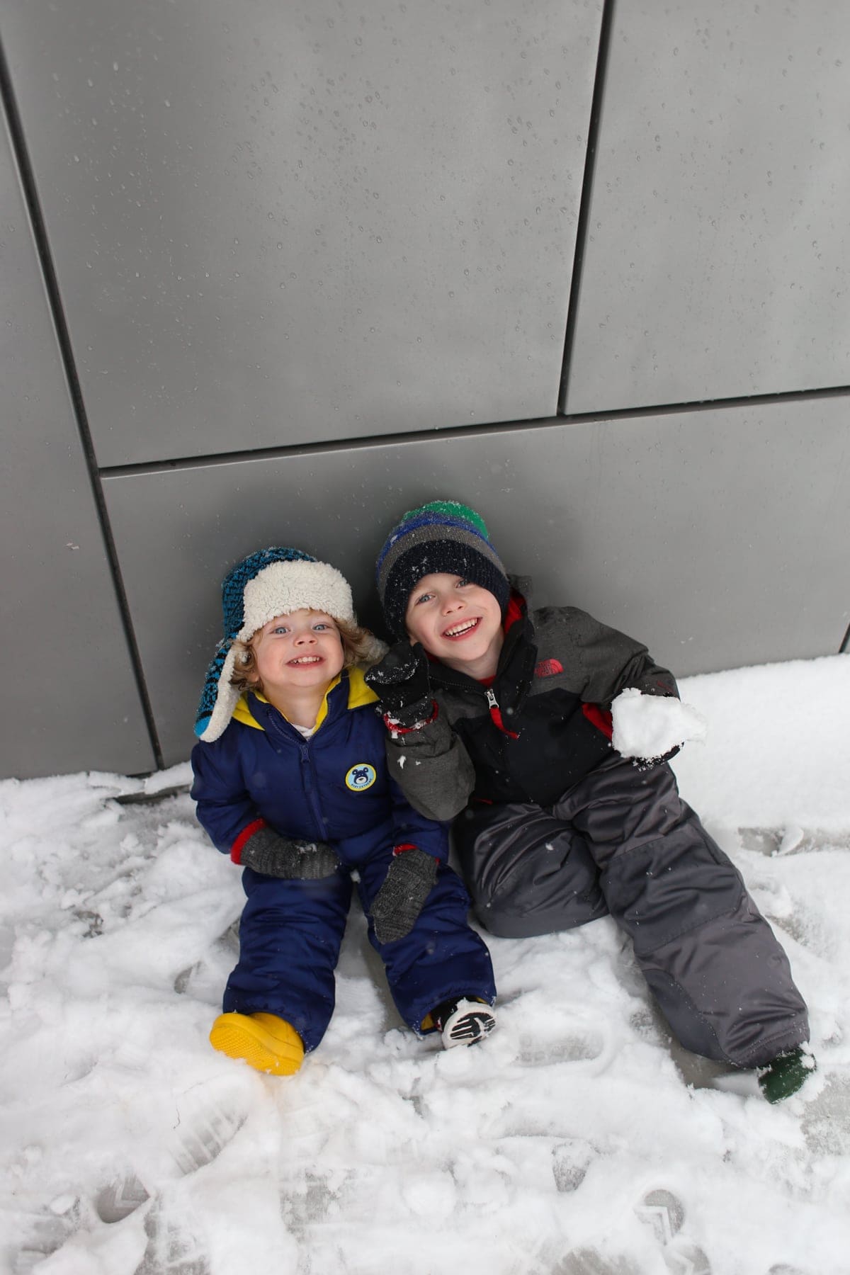Eddie and Blake sitting in the snow