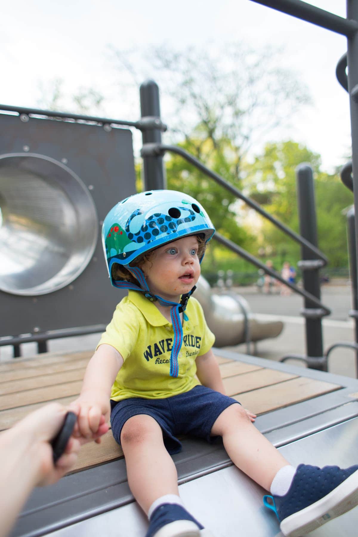 Eddie playing on a play structure