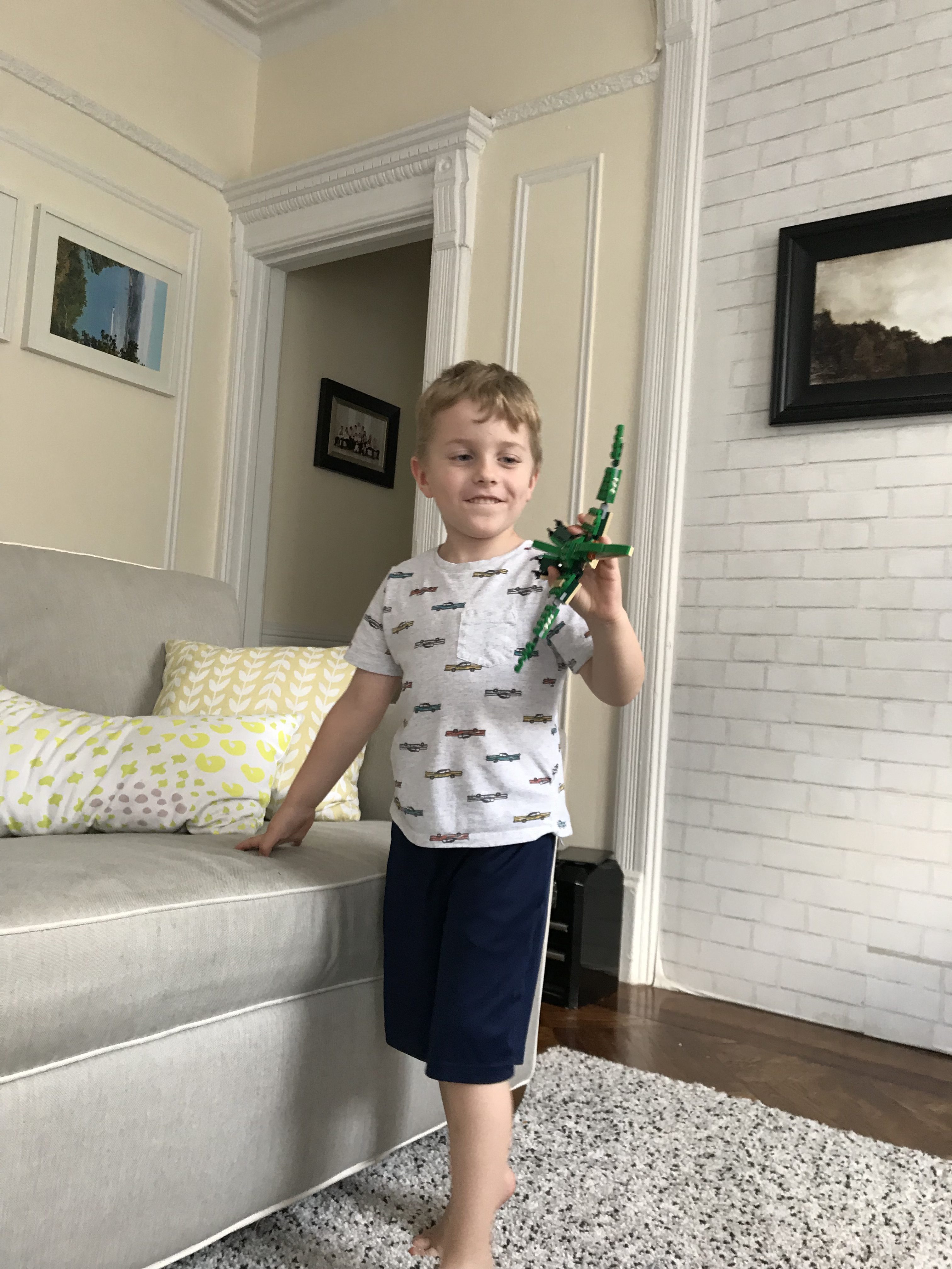 Blake with a toy dinosaur