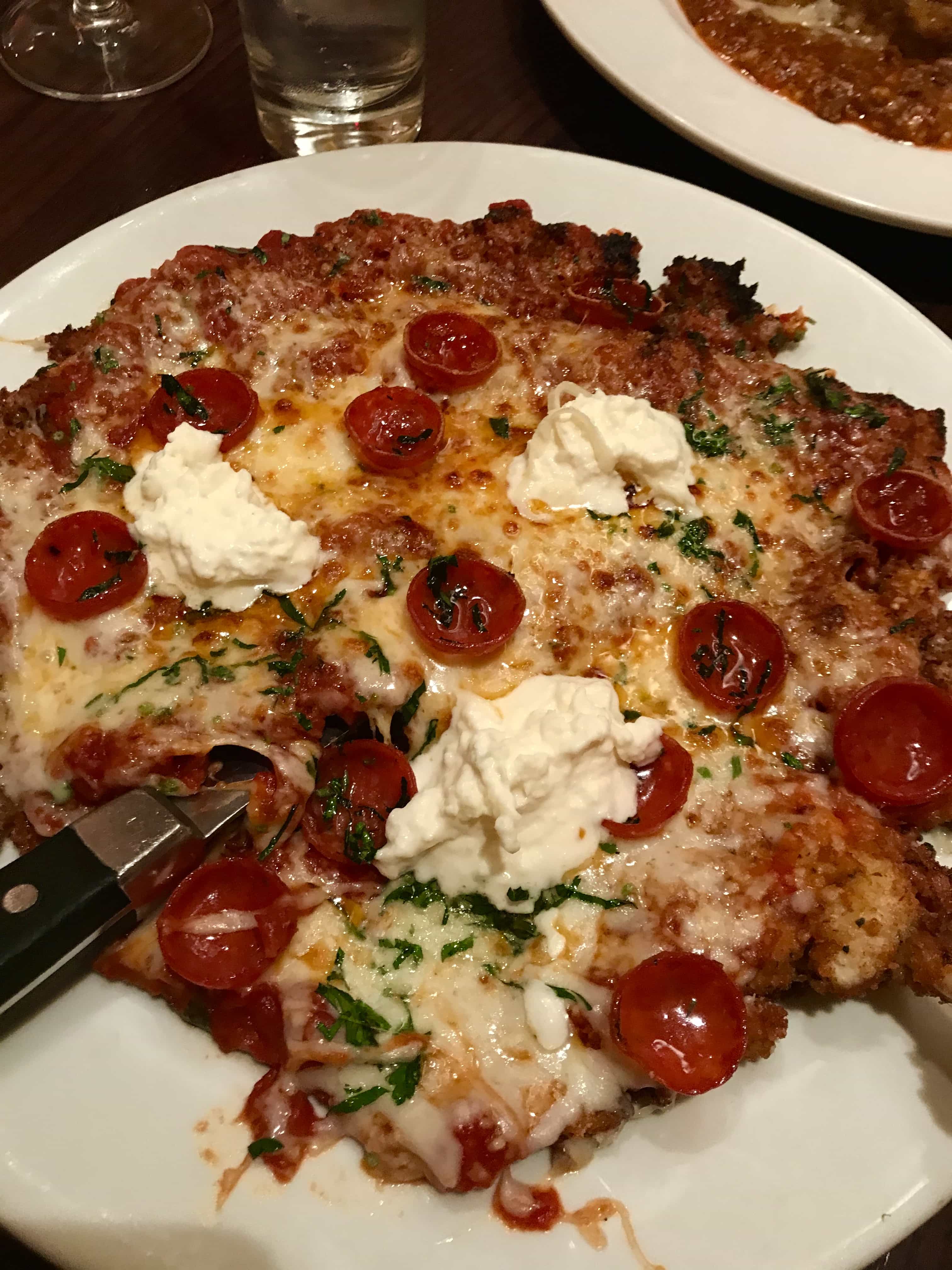 A close up of a plate of pizza