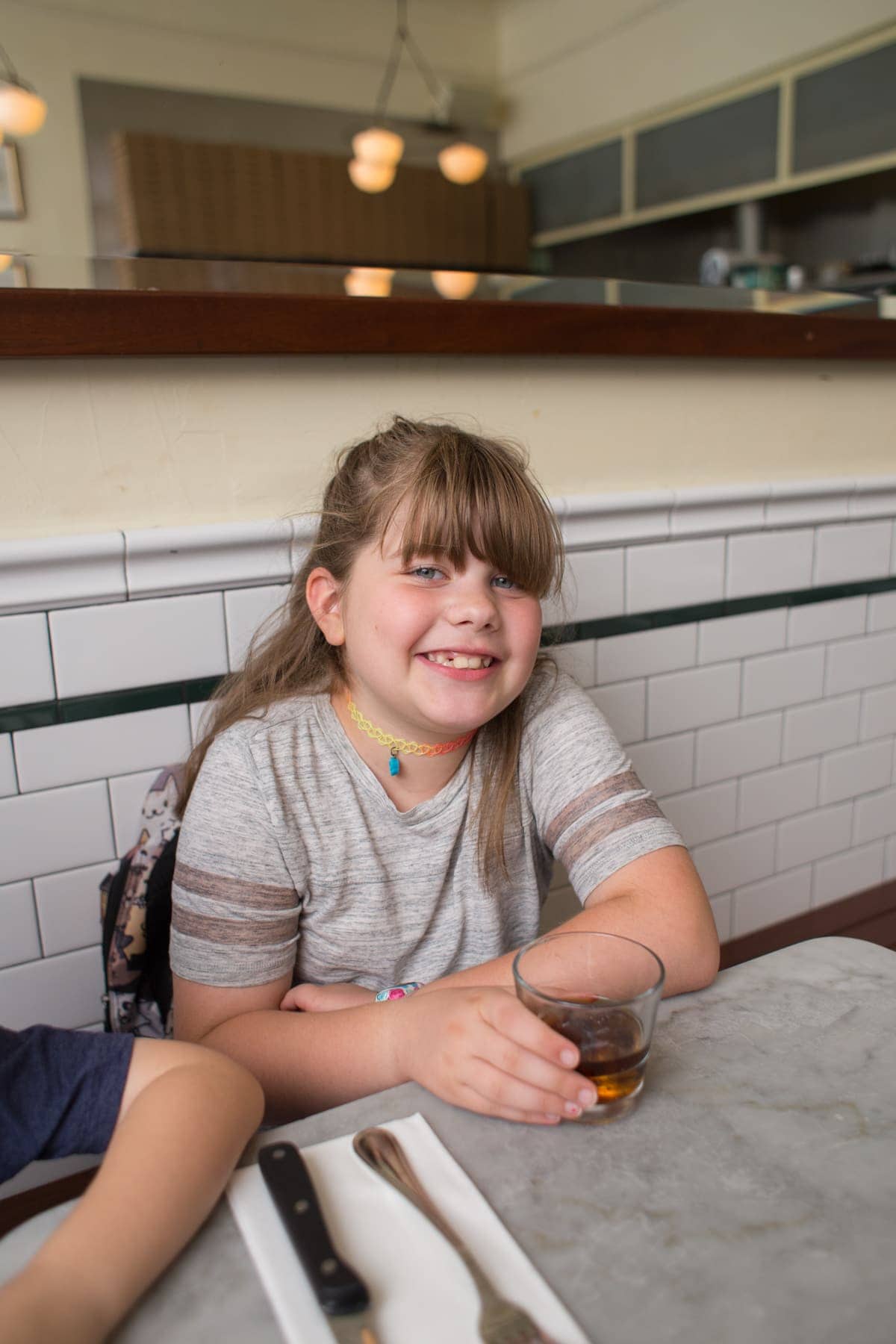 Brooke sitting at a table
