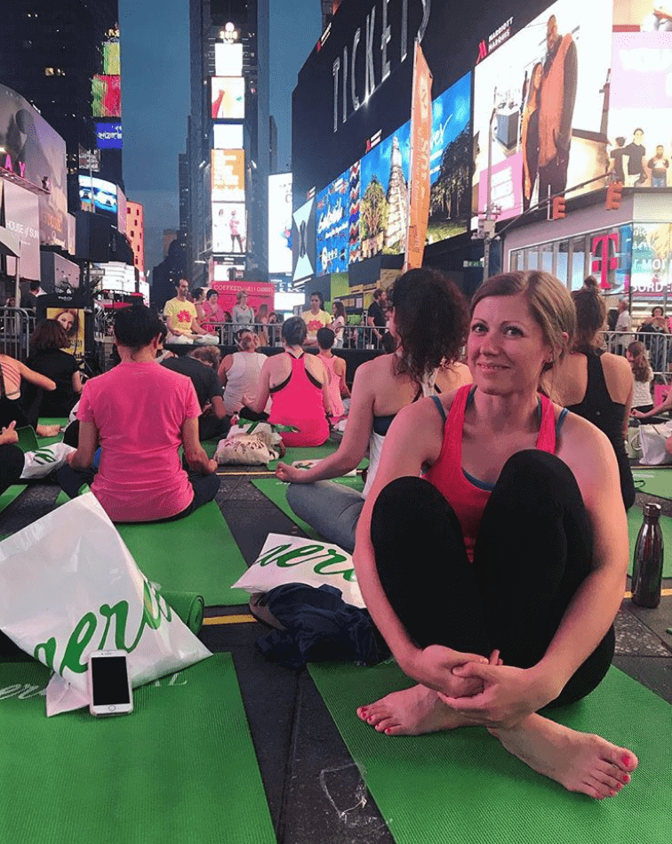 Lauren doing yoga in Times Square