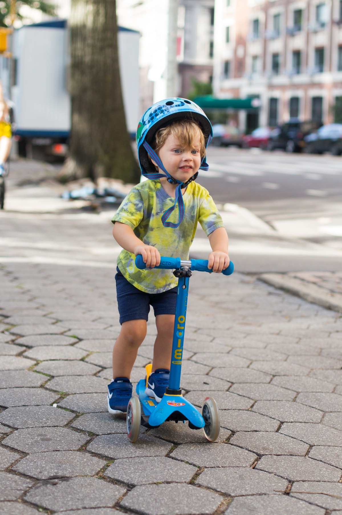 Eddie riding a scooter