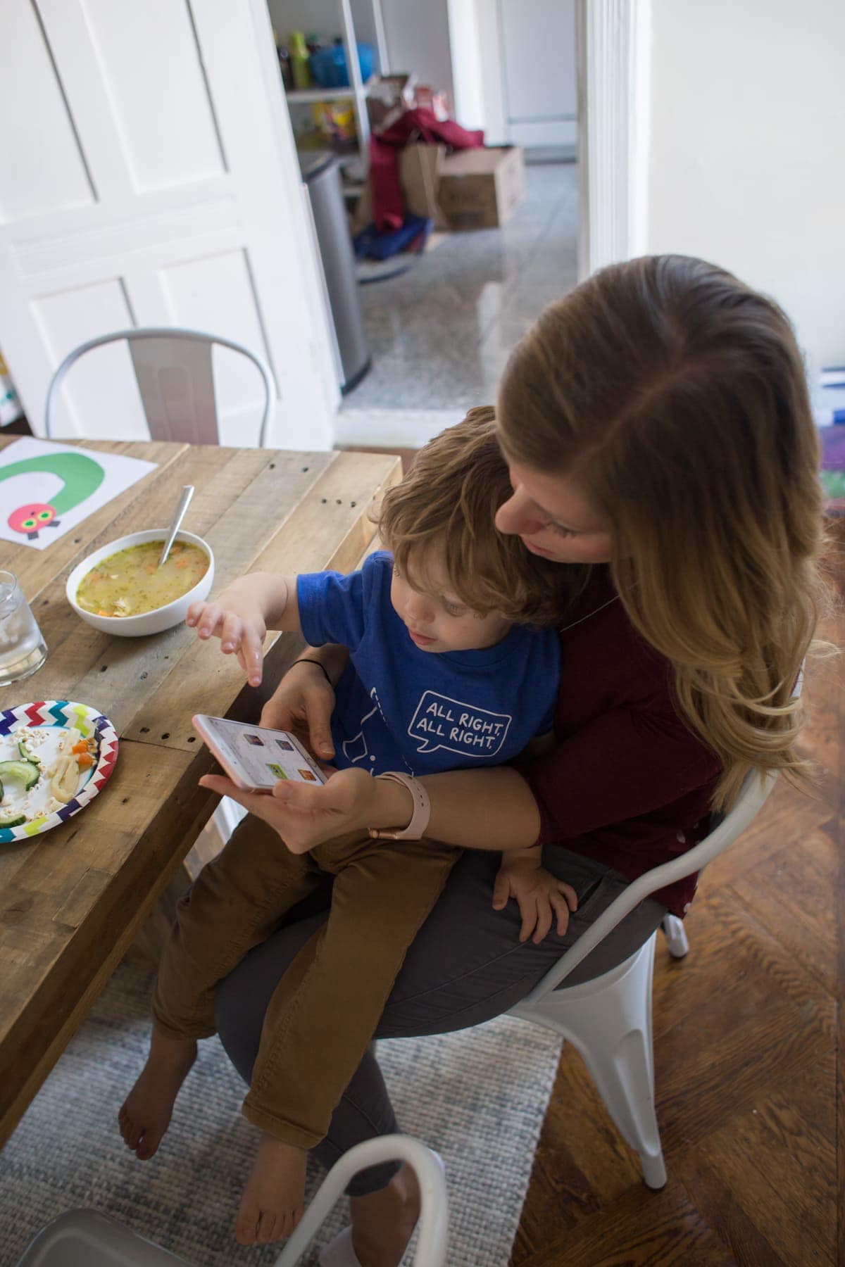 Lauren and Eddie looking at her phone