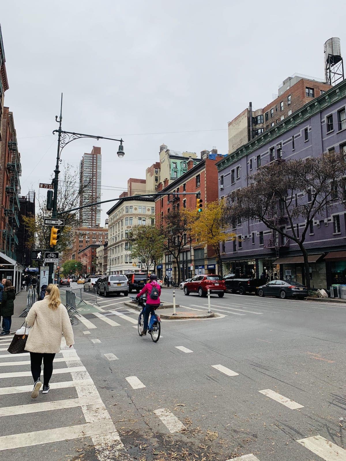 A group of people walking down the street
