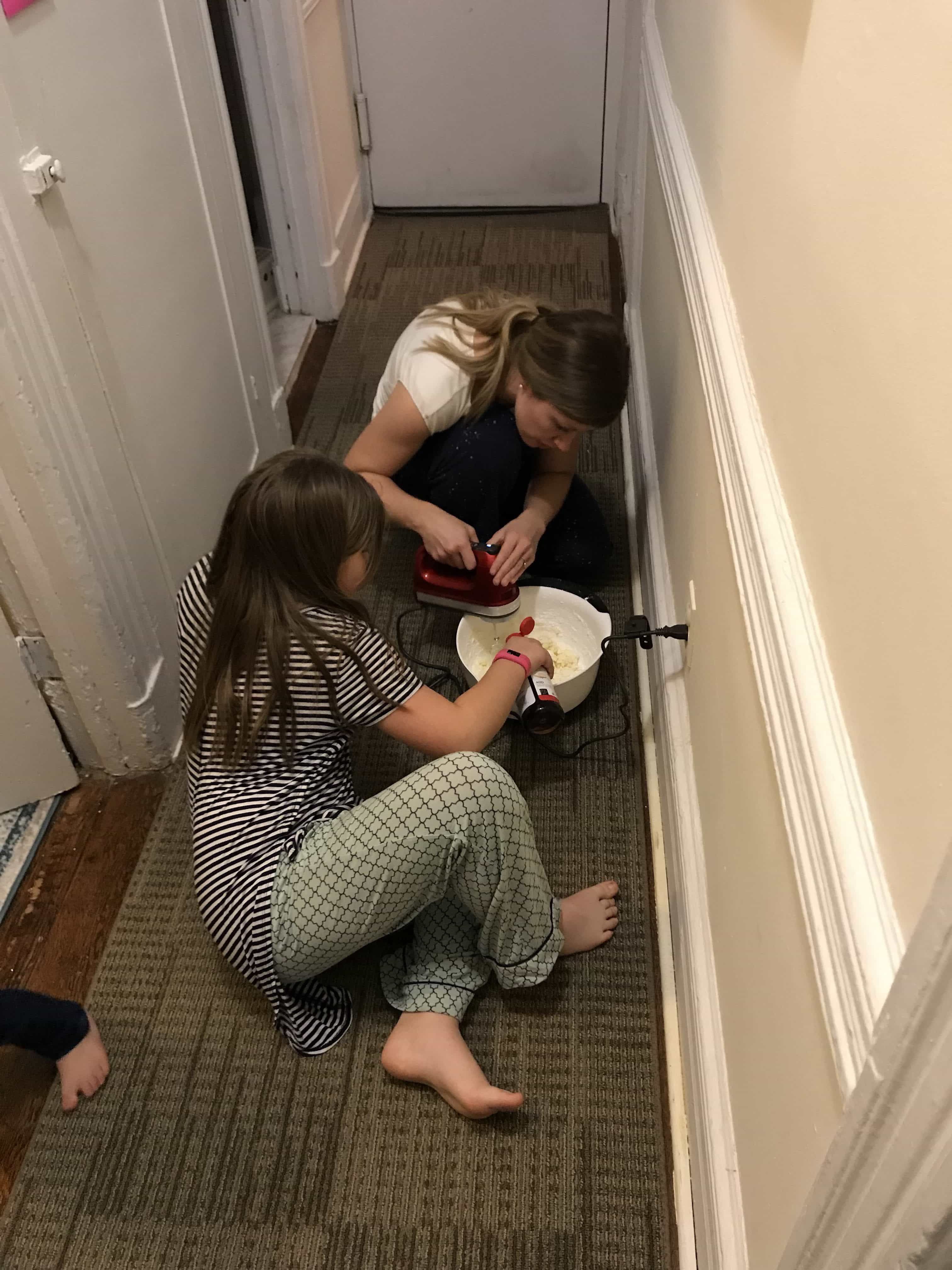 Brooke and Lauren making frosting in the hall