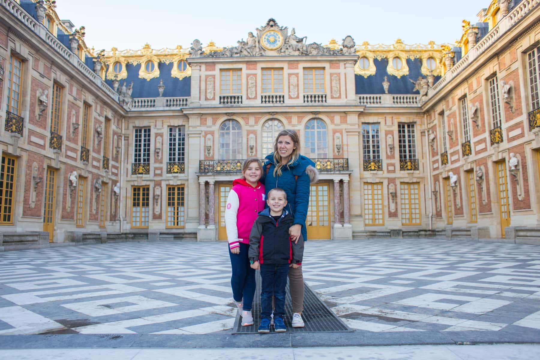 Lauren Brooke and Blake in front of the Palace of Versailles