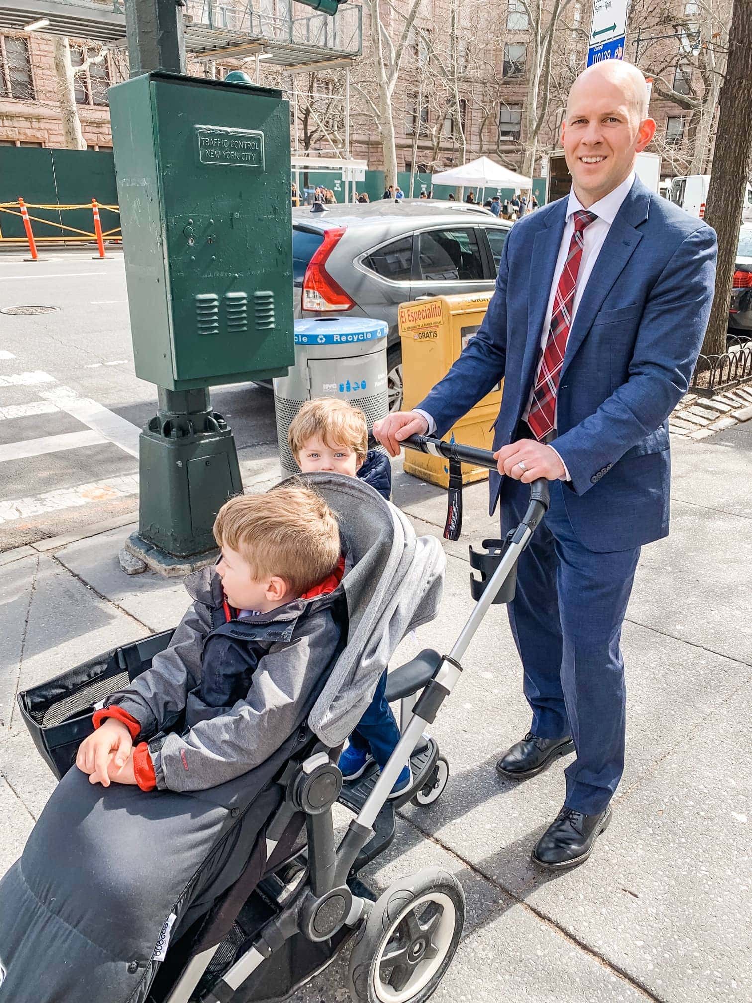 Gordon pushing the stroller with Blake and Eddie