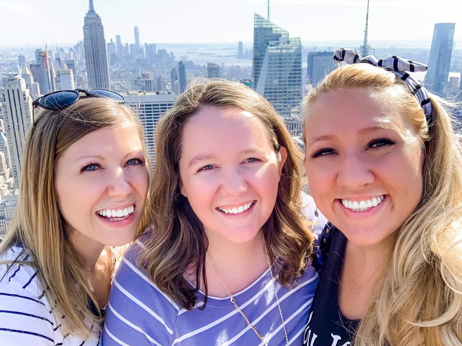 Lauren and friends with the city behind them