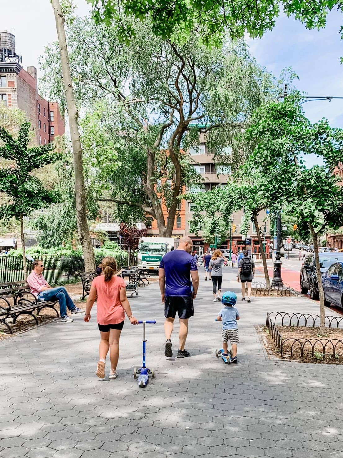 Gordon and kids walking down the sidewalk