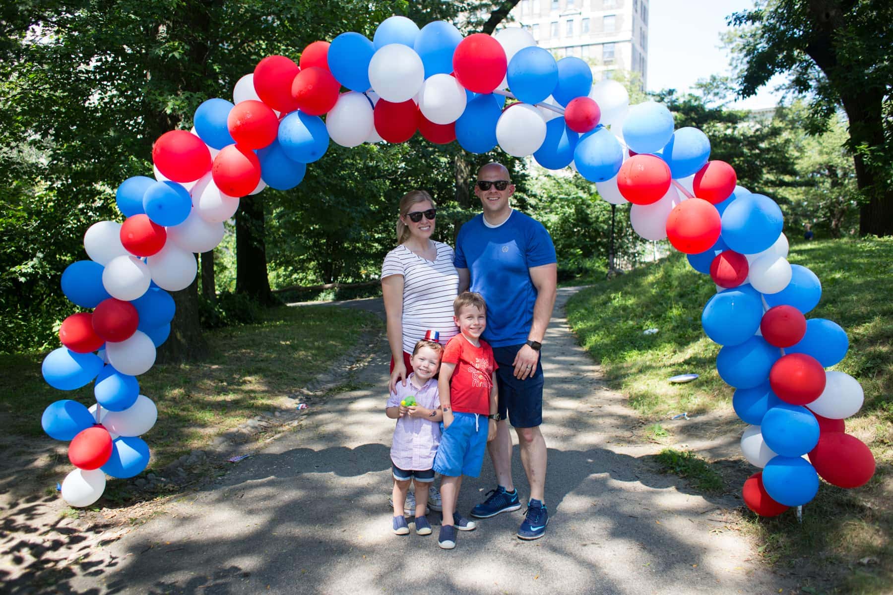 Family under the balloon arch