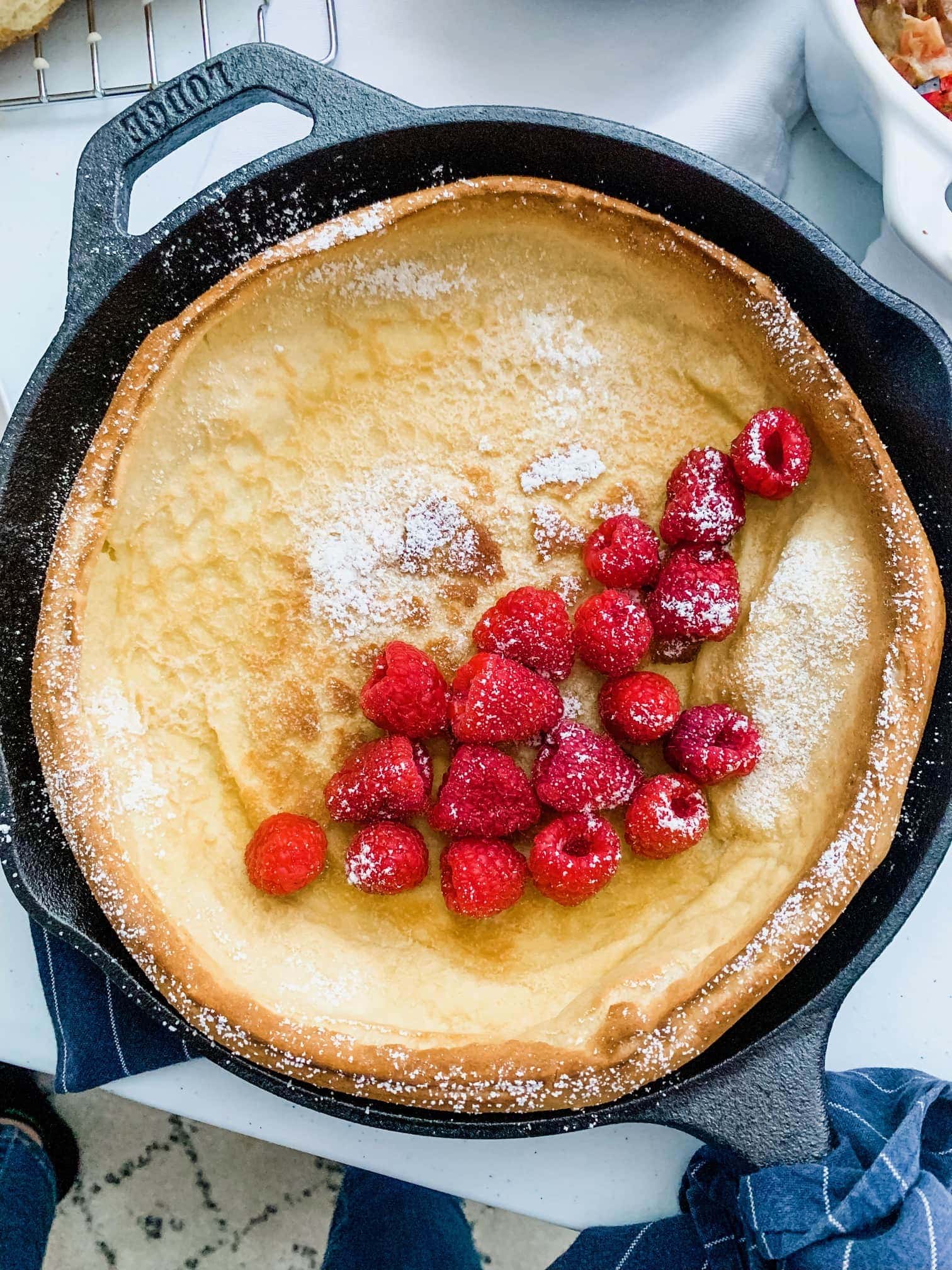 German pancakes with raspberries and powdered sugar