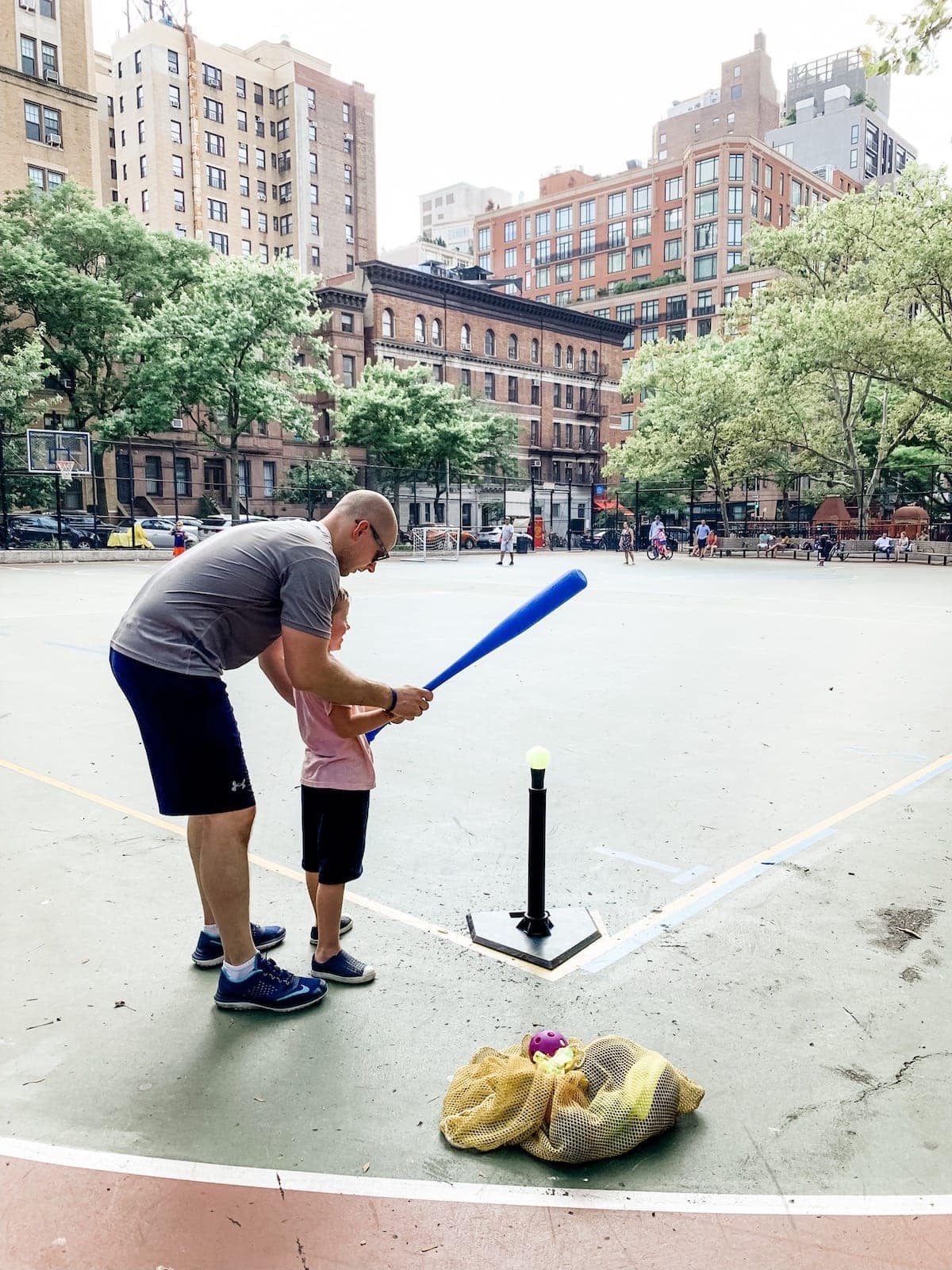 Gordon helping blake with T-ball