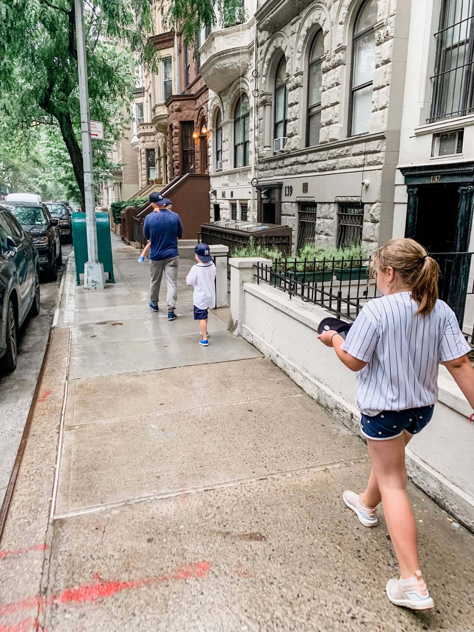 Gordon and the kids walking on the sidewalk