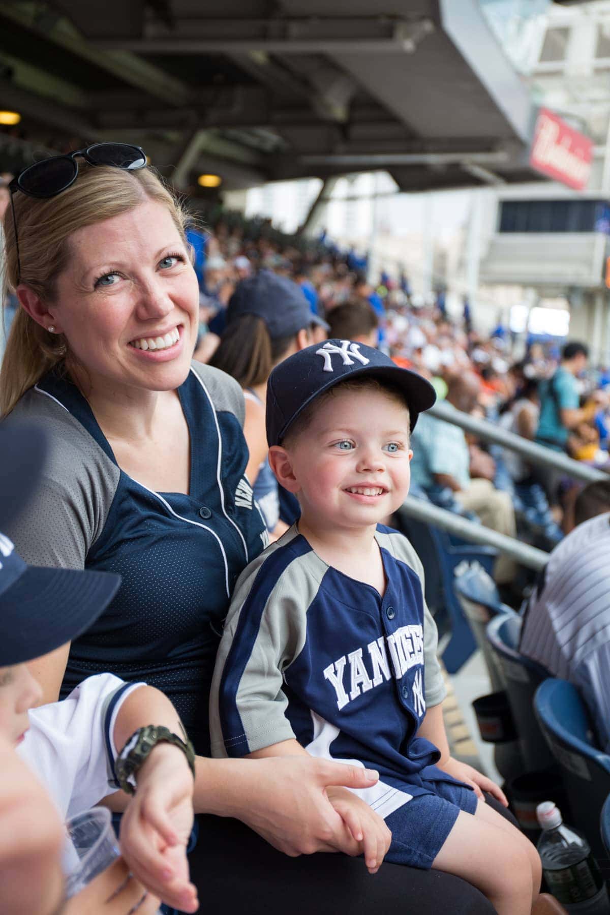 A group of people sitting at a baseball game
