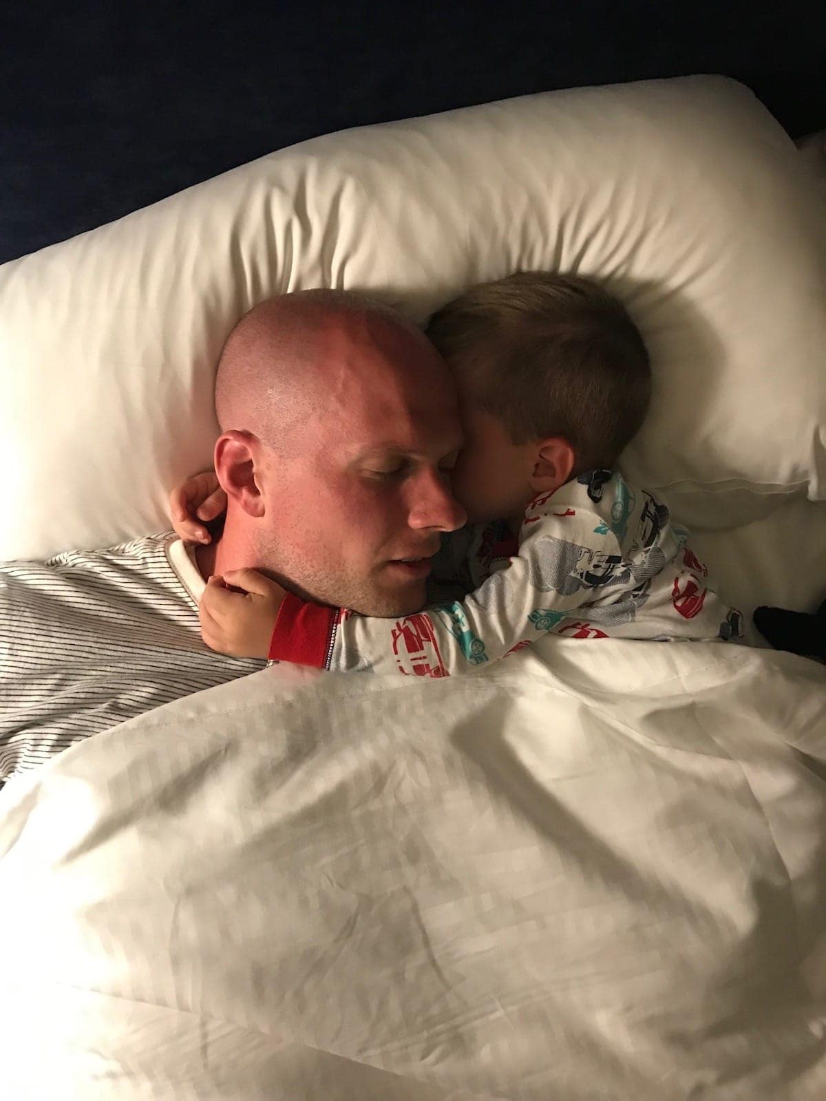 Gordon and Eddie cuddling in bed