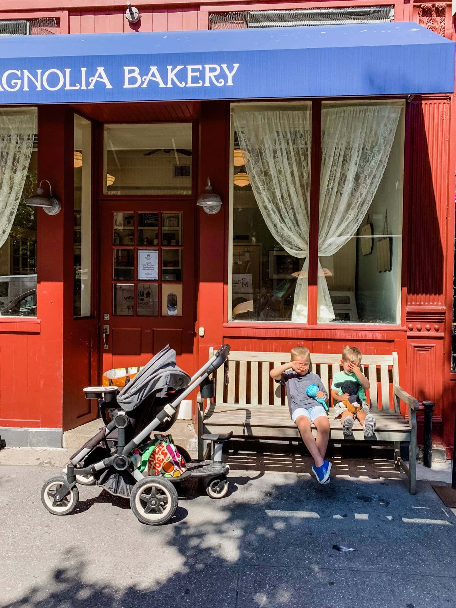 Stroller and the boys in front of Magnolia Bakery