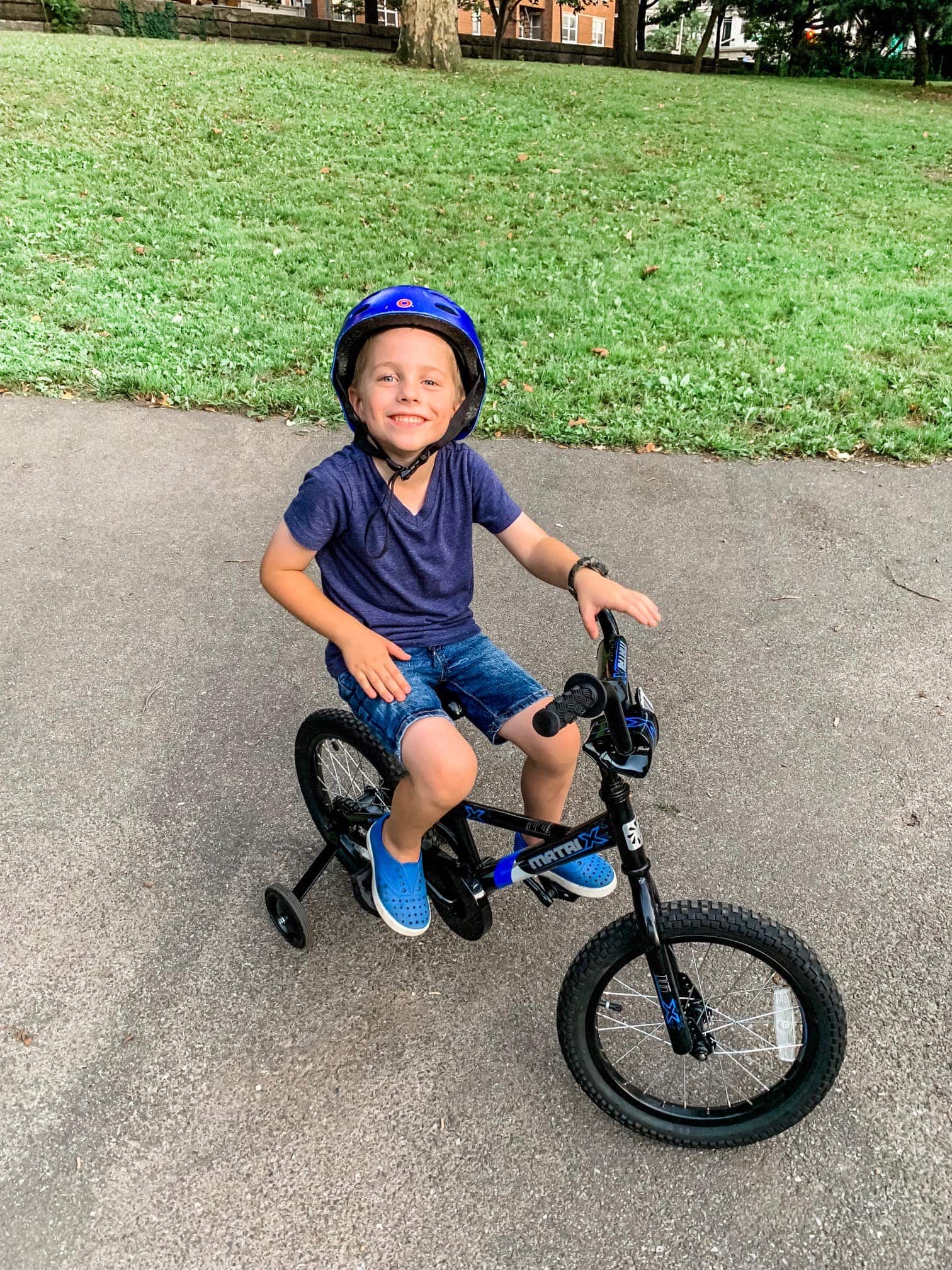 Blake wearing a helmet and riding a bicycle