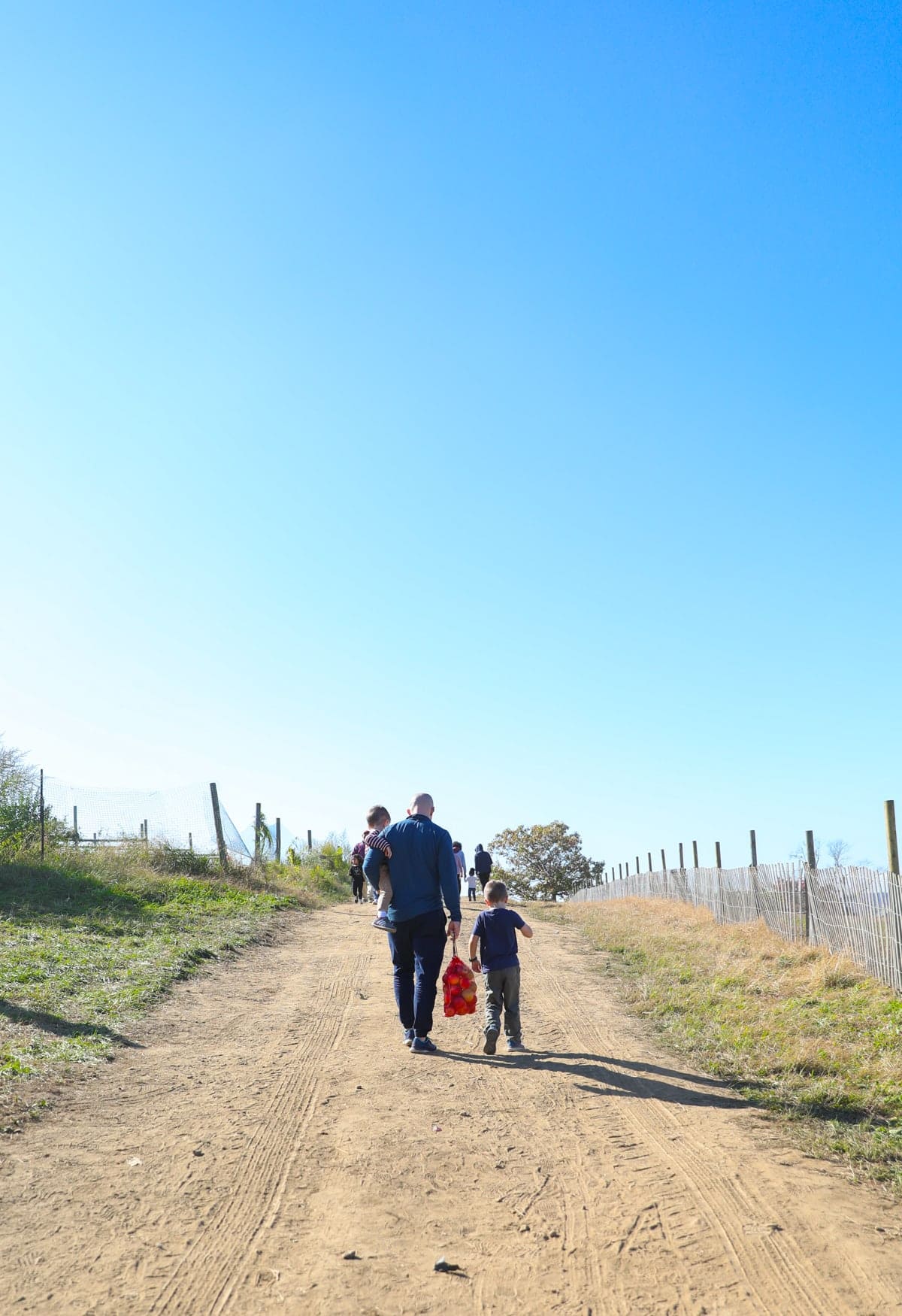 Gordon and Eddie walking down a dirt road