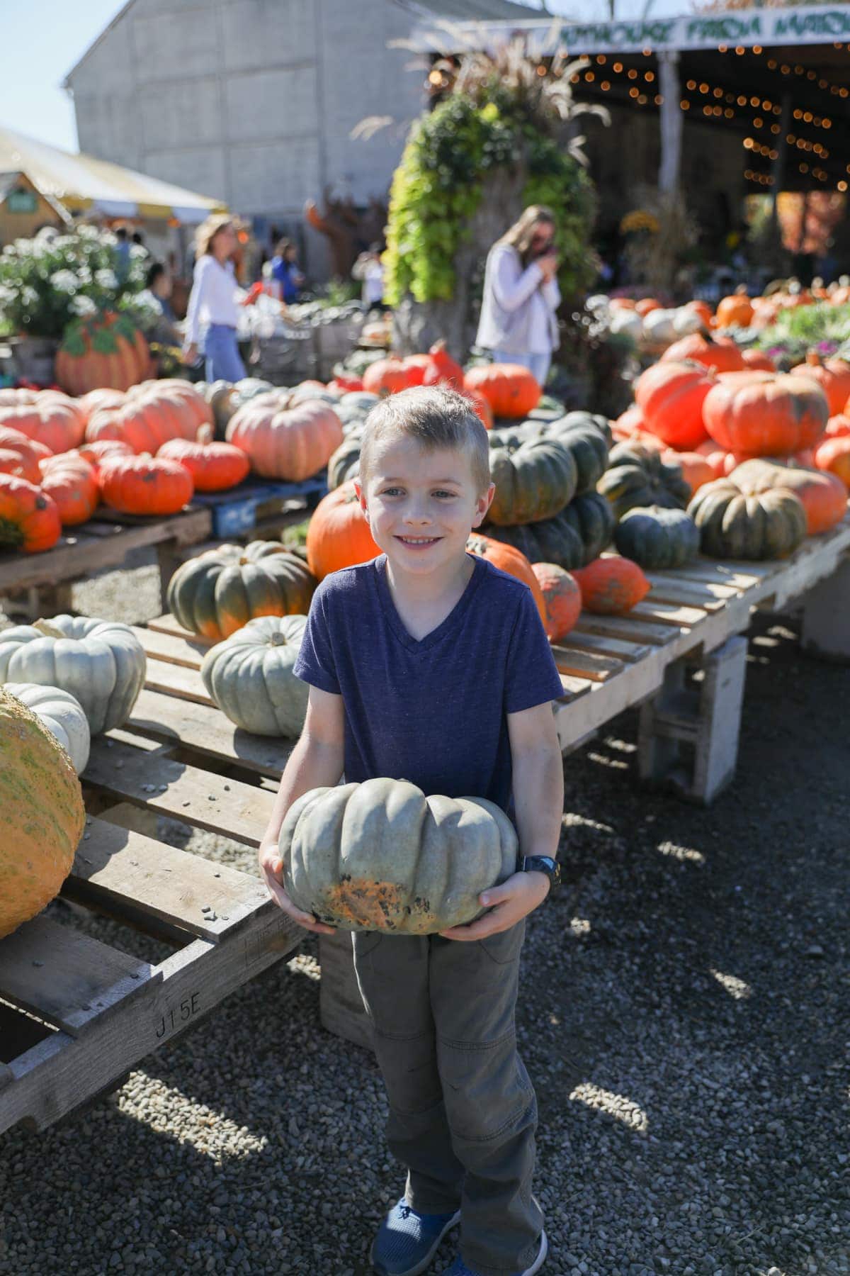 Blake picking out a pumpkin
