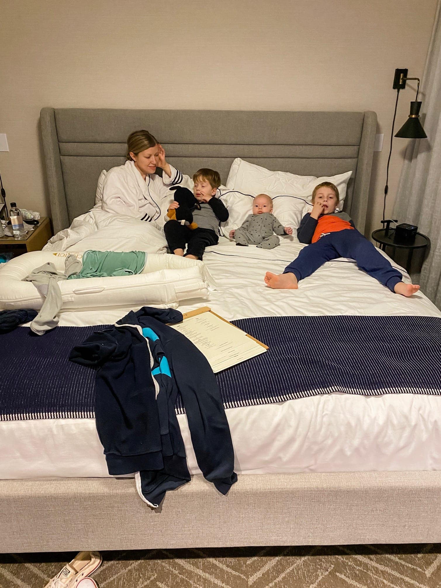 Lauren and kids lying on a bed