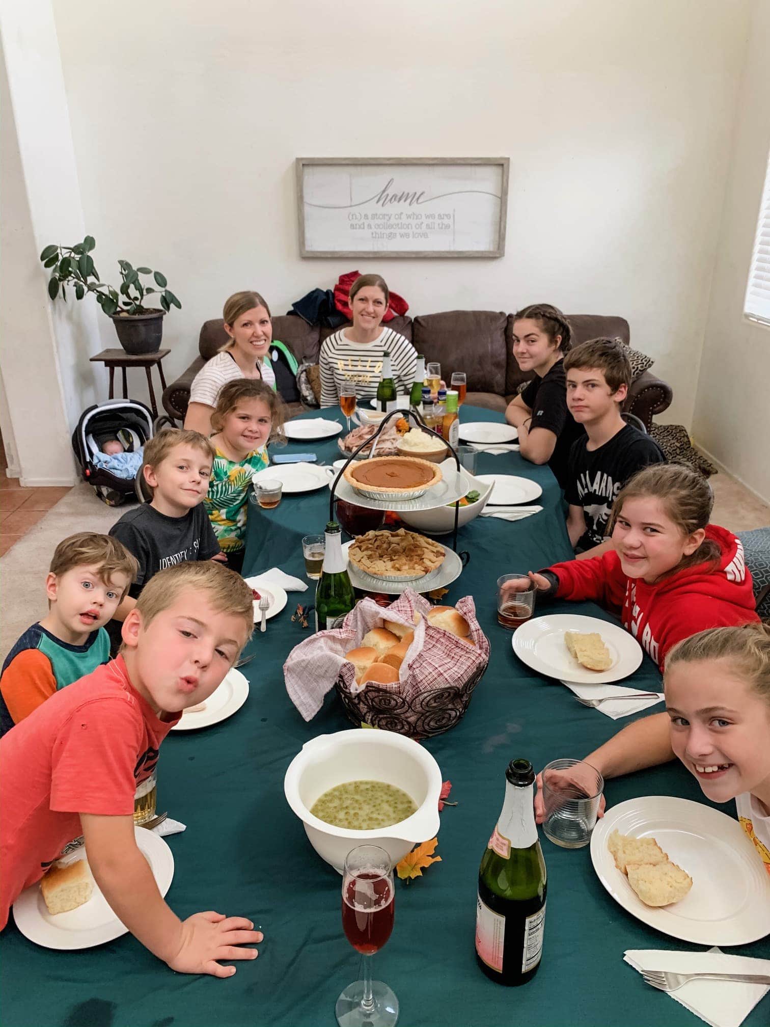 A group of people sitting at a table eating food