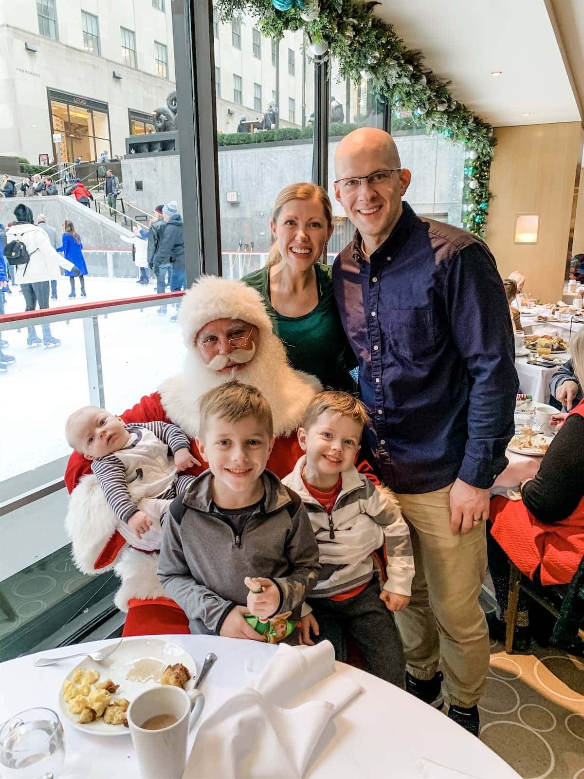Brennan family posing with Santa claus