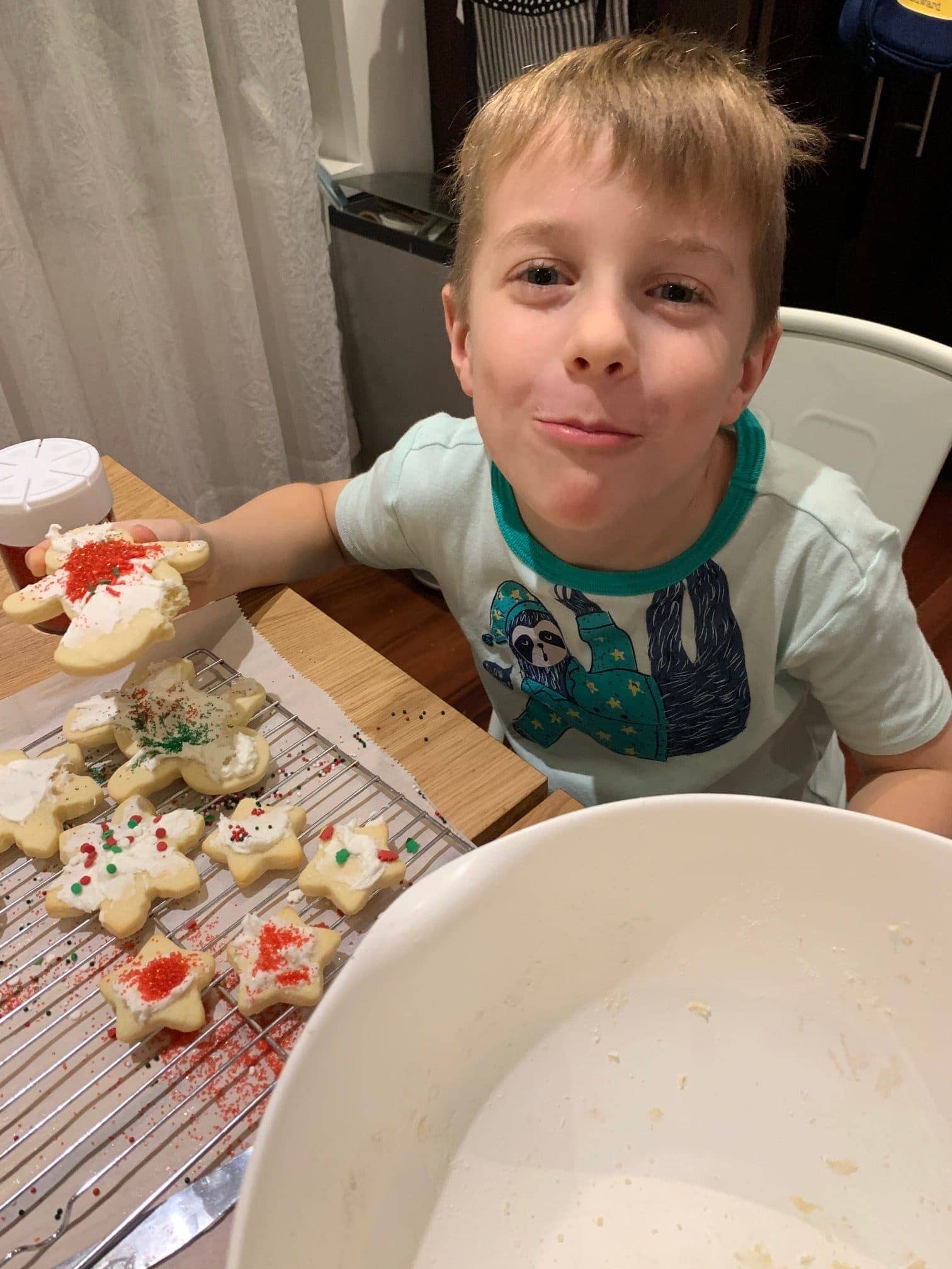 Blake eating a decorated sugar cookie
