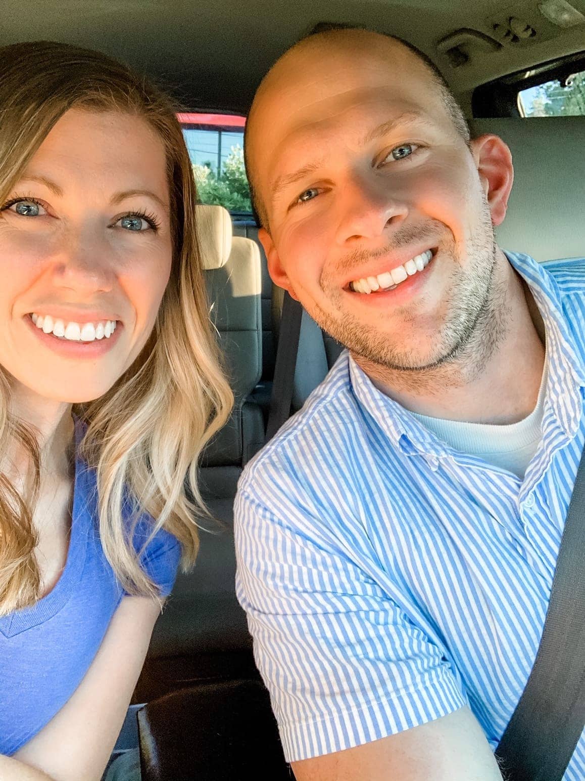 husband and wife selfie in a car