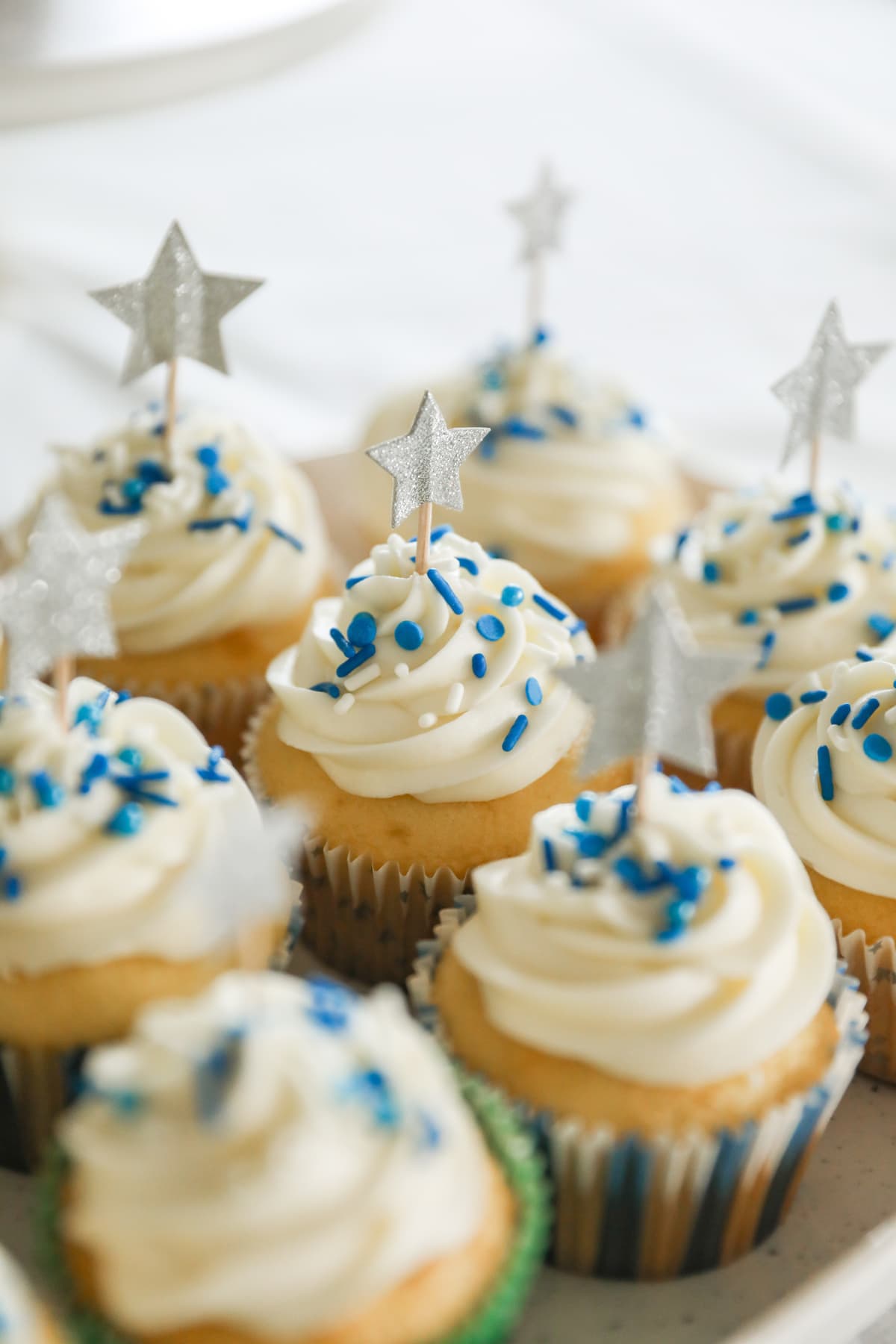 vanilla cupcakes with star decorations